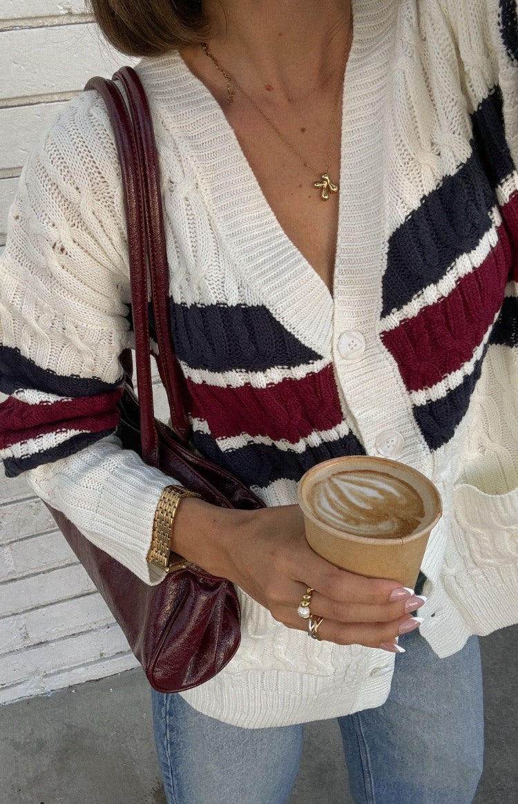Beginning Boutique Nikkitta Cream Striped Cardigan cream cable knit V-neck cardigan with navy and burgundy stripes and button