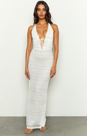 White lace halter maxi dress with a deep V-neck, tie-front bust, and fitted lace bodice