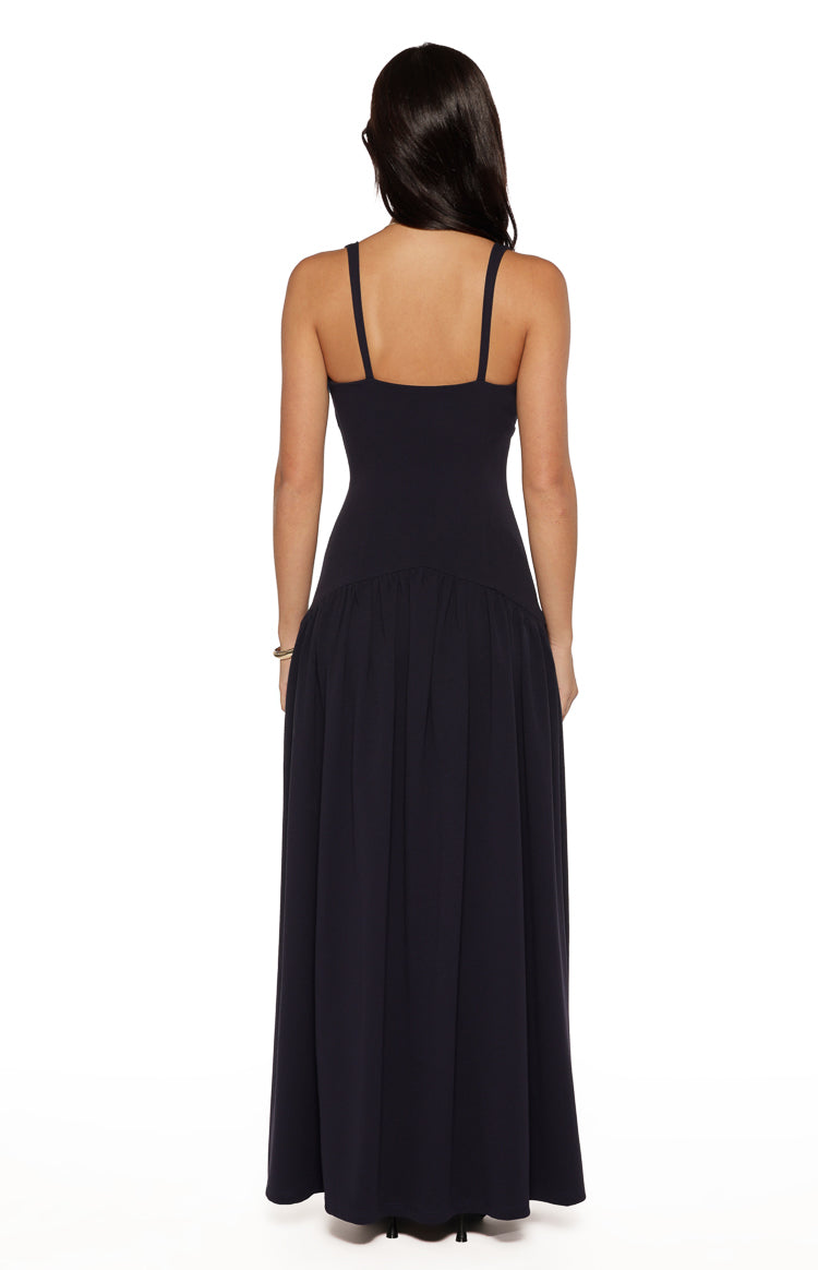 Back view of the navy crepe maxi dress with thin straps and a gathered drop waist