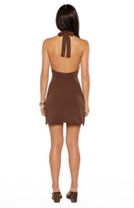 Rear view of a brown halter neck mini dress showing the tie closure at the nape and open back