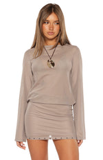 Brown sheer mesh mini dress with a round neckline, long sleeves, and square stud details on the hem