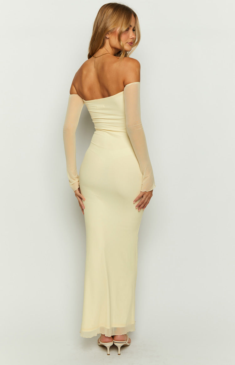 Rear view of a cream strapless maxi dress with a fitted silhouette and sheer long sleeves