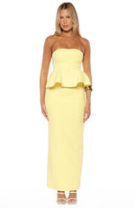 Front view of a yellow crepe strapless top with a wide peplum hem
