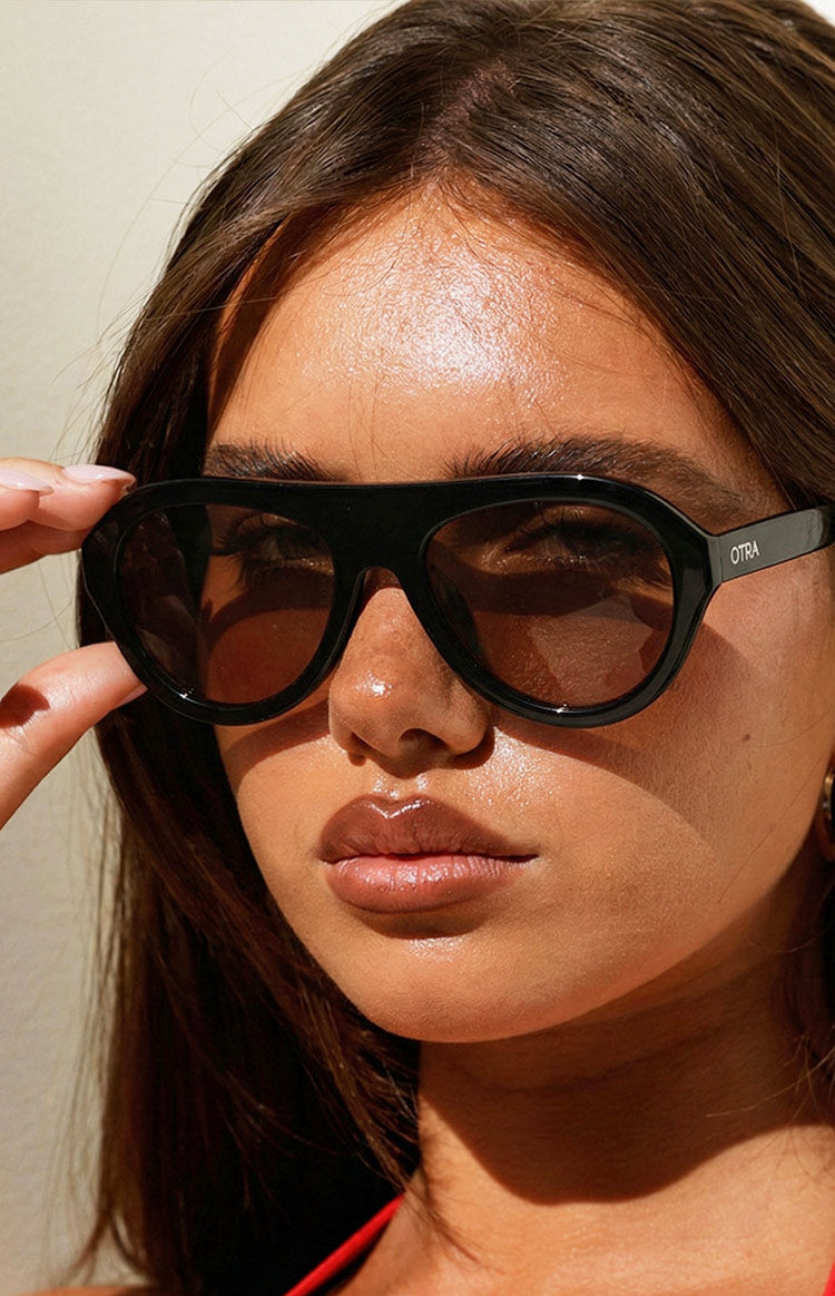 Beginning Boutique Otra Eyewear Maddy Black Aviator Sunglasses black aviator sunglasses with thick frames and brown tinted lenses