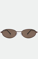 Brown oval-framed sunglasses worn with a grey pinstripe blazer and a black top.