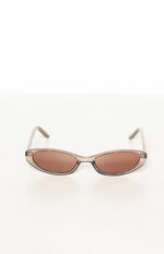 Translucent olive brown cat eye sunglasses with brown lenses from a slightly elevated front view