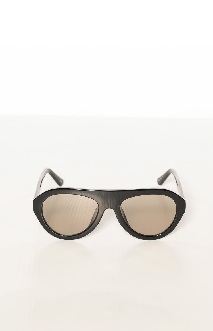 Front view of black aviator sunglasses with dark lenses and a subtle wood-grain texture on the frames
