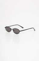 Beginning Boutique Otra Eyewear Rosie Black Oval Sunglasses black oval sunglasses with thin frames and dark lenses