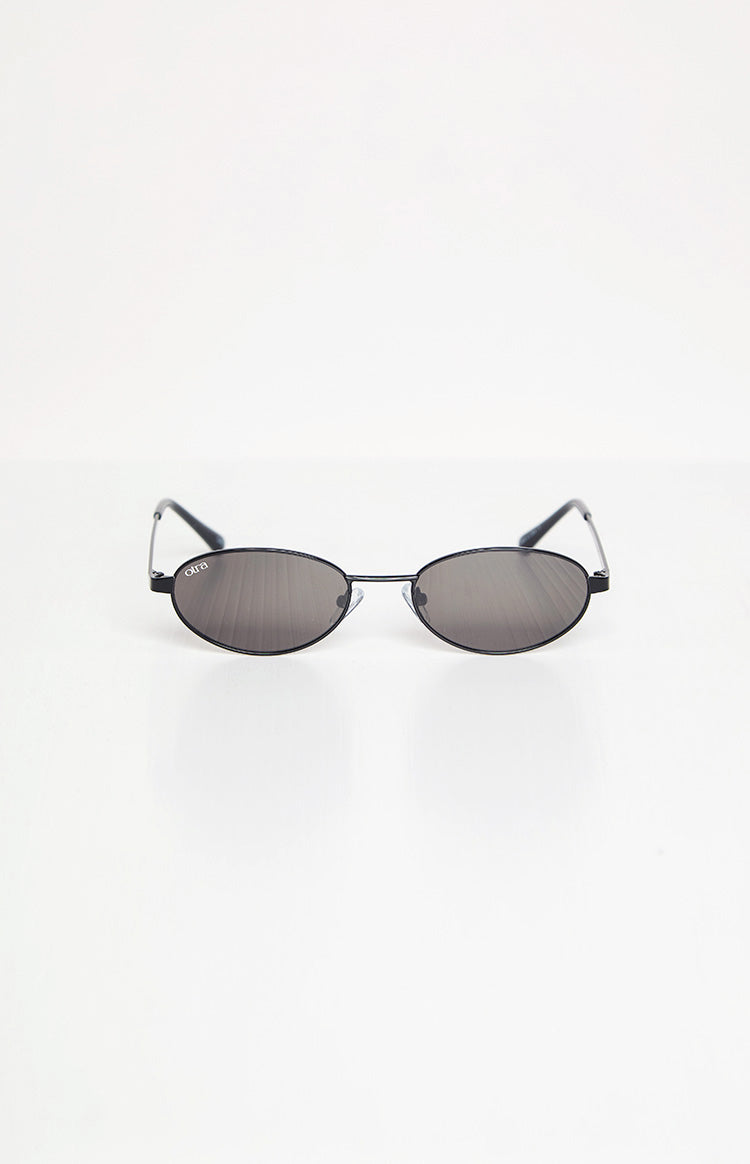 Black oval sunglasses with thin metal frames and dark grey lenses
