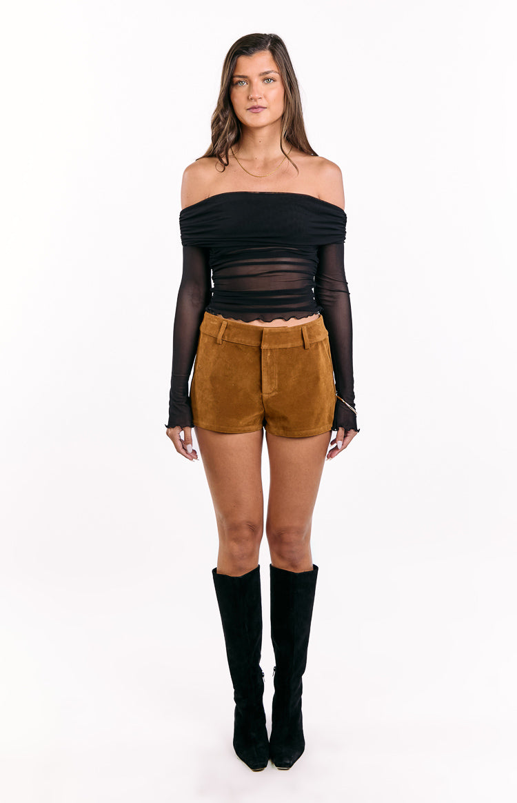 Front view of tan suedette shorts with a high waist, belt loops, and a scalloped hem