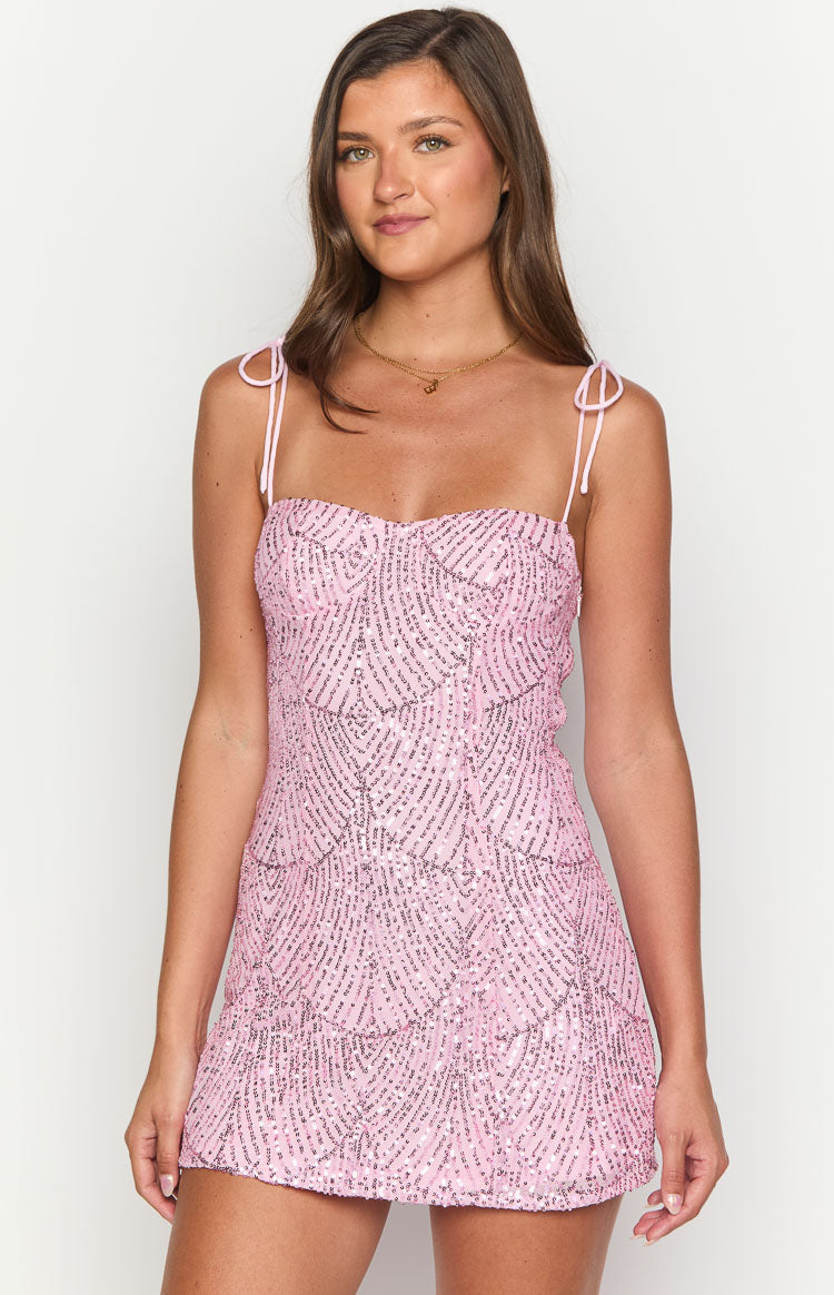 Pink sequin mini dress featuring a sweetheart neckline, tie-shoulder straps, and a detailed sequin pattern
