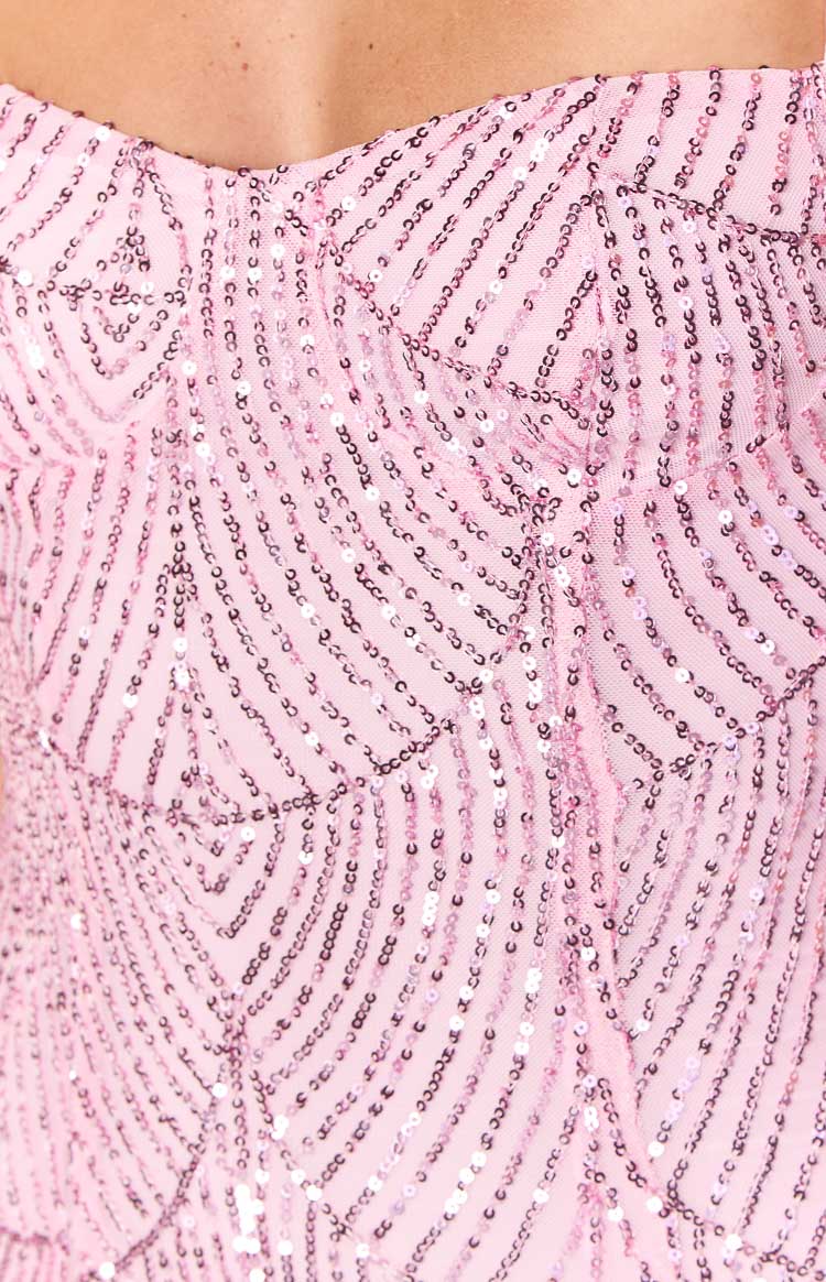 Close-up of the pink sequin mini dress with a shimmering zig-zag pattern
