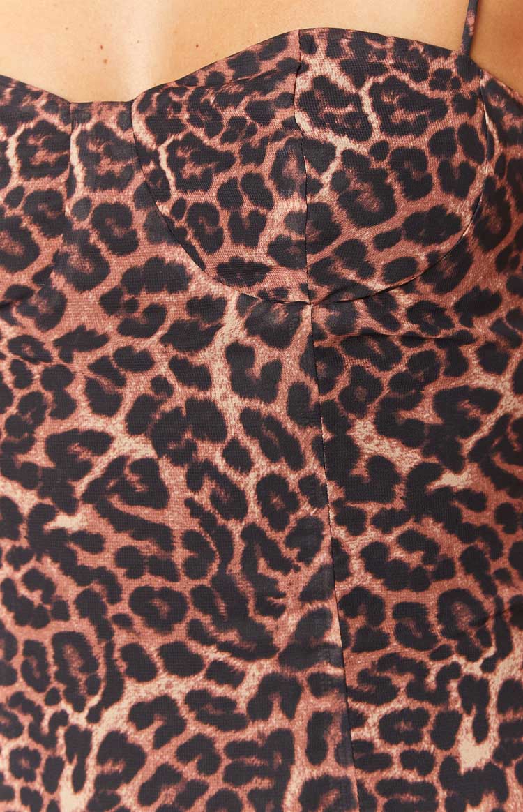 Close-up of the sweetheart neckline and bust seams on a leopard print mini dress