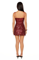 Red sequin mini dress from the back, featuring a straight neckline and delicate tie-up spaghetti straps