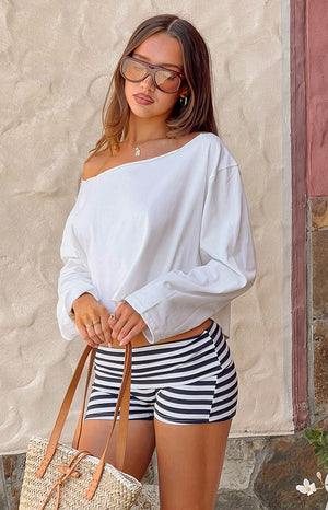 Beginning Boutique Phoenix White Off Shoulder Long Sleeve Top white relaxed fit off-shoulder long sleeve crop top