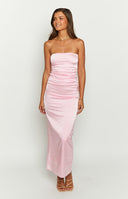 Full length view of a fitted pink satin strapless maxi dress with ruched side detail