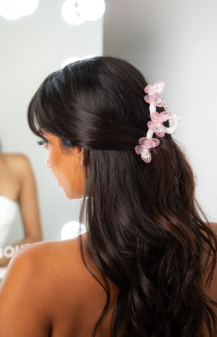 Side view of the pink iridescent butterfly claw clip with multiple iridescent butterflies
