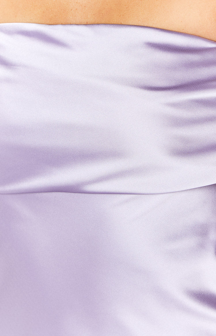 Close-up showing the smooth texture and draped detail of the purple satin mini dress