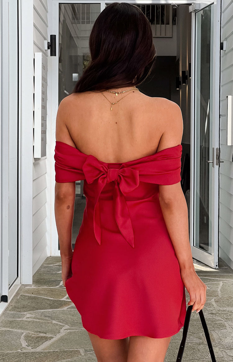 Beginning Boutique Primrose Red Satin Off the Shoulder Mini Dress red satin off-the-shoulder mini dress with a large back bow
