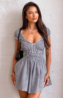 Beginning Boutique Raldo Black Gingham Playsuit black and white gingham playsuit with a shirred bodice, tie-front neckline, a