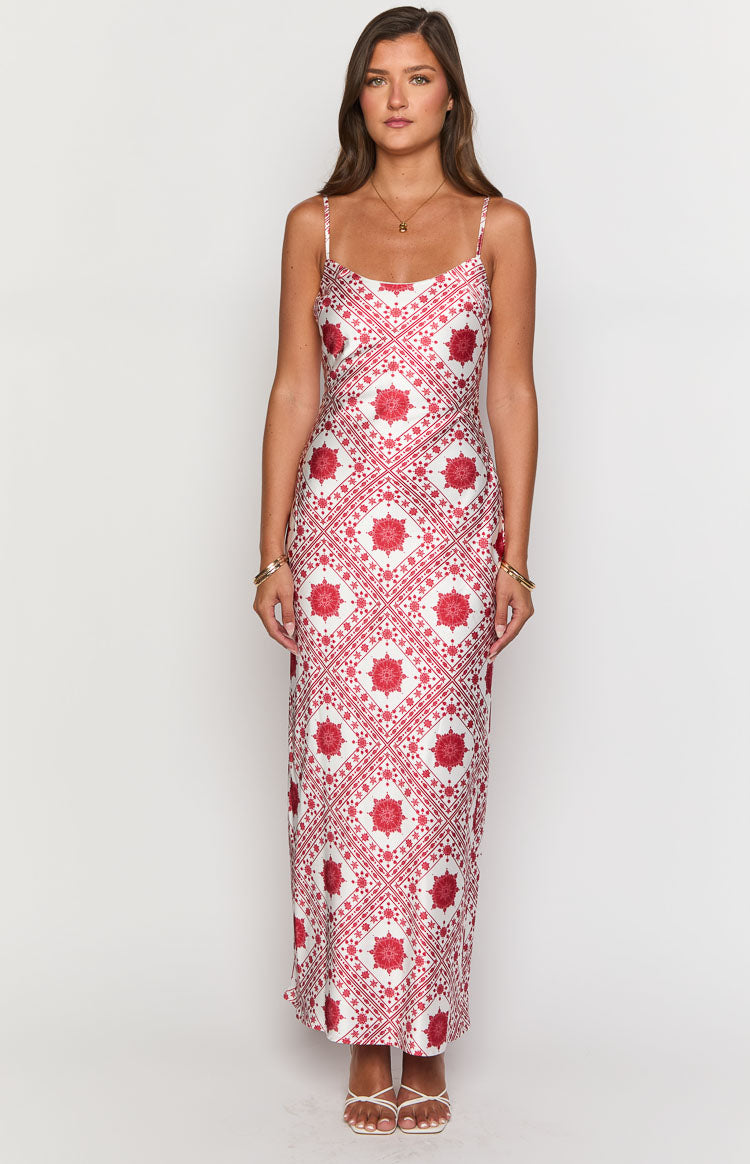White maxi dress with a red geometric tile print, scoop neckline, and fitted silhouette