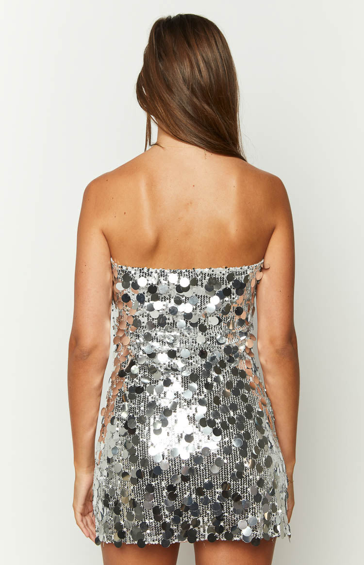 Back view of a silver sequin strapless mini dress with a straight neckline and all-over large disc sequins