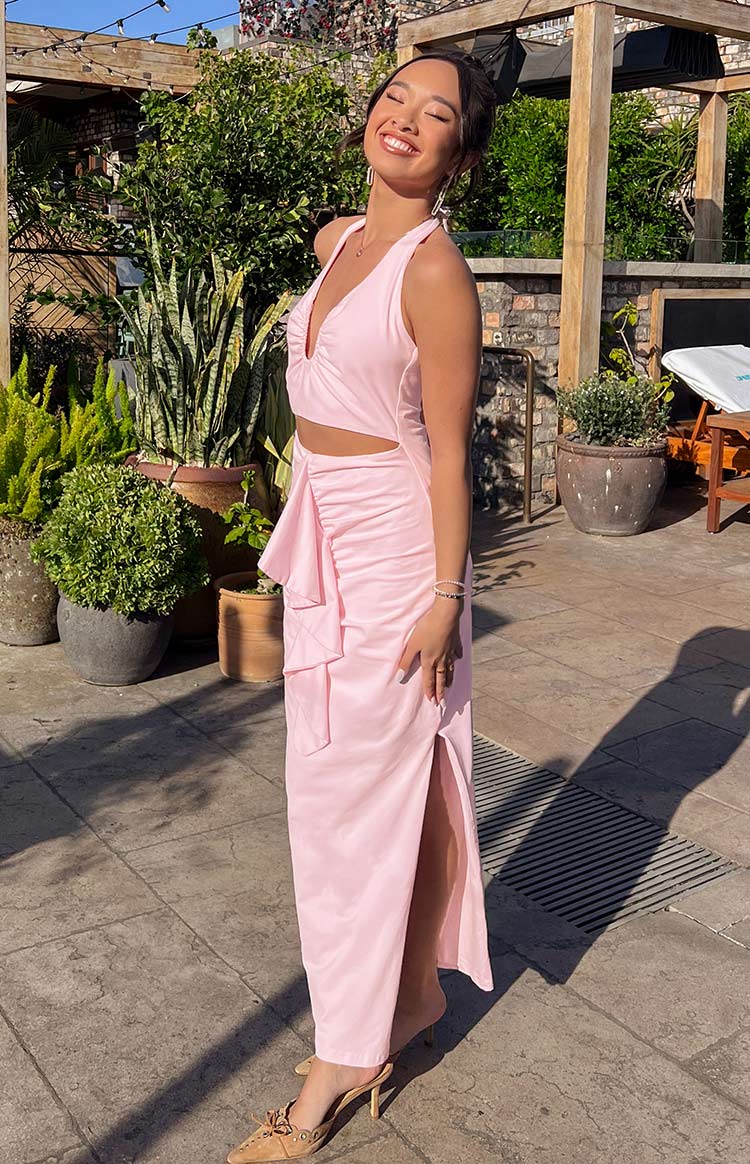 Beginning Boutique Raelynn Pink Maxi Dress pink satin halter neck maxi with deep V-neck, waist cutouts, side ruching, and high slit