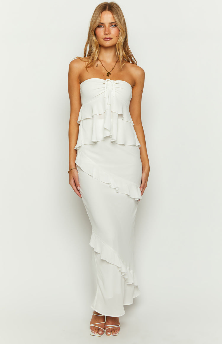 Front view of a white fitted maxi skirt with a long diagonal ruffle detail