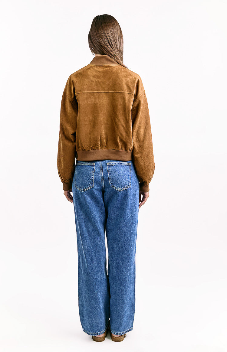 Back view of a tan suedette bomber jacket with a ribbed collar, ribbed hem, and long cuffed sleeves