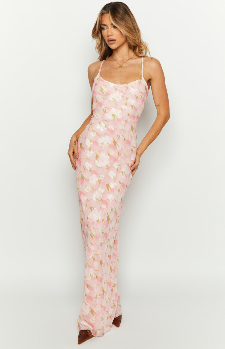 Pink floral chiffon maxi dress with a scoop neck, thin spaghetti straps, and a fitted silhouette