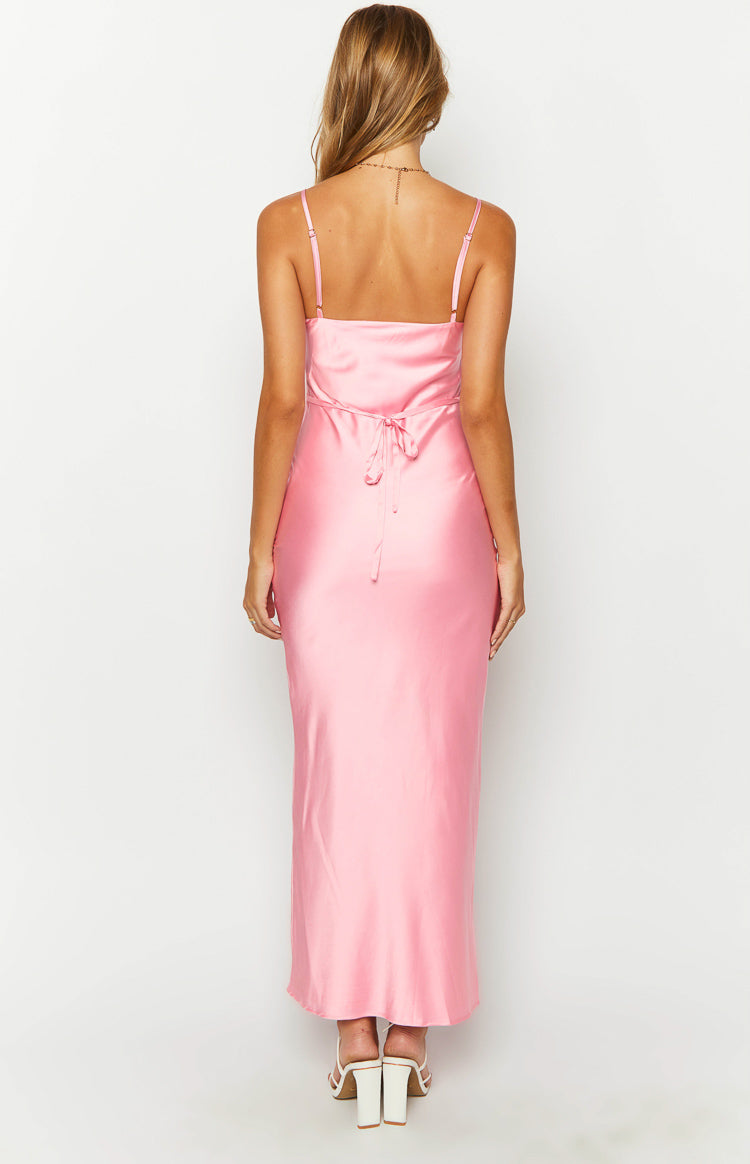 Rear view of a pink satin maxi dress showing adjustable spaghetti straps and a tie-back detail