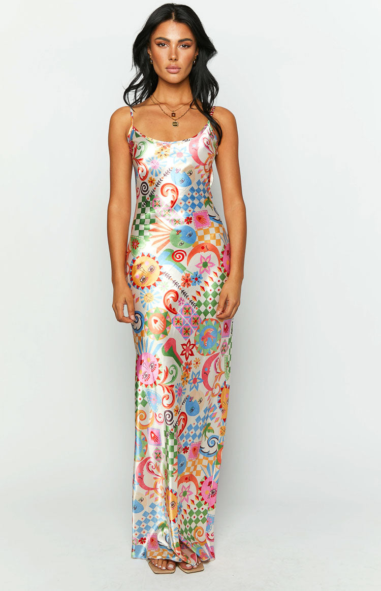 Colourful satin maxi dress with an all-over psychedelic print featuring suns, moons, checkerboards, and floral motifs