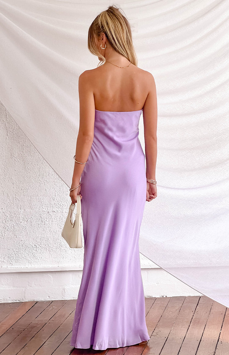 Rear view of a lilac satin strapless maxi dress with a sleek, fitted silhouette