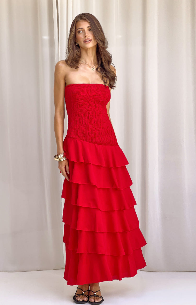 Full length red strapless maxi dress with a shirred bodice and tiered ruffle skirt