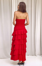 Rear view of a red strapless maxi dress with a shirred bodice and tiered ruffle skirt