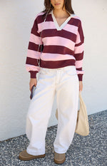 Beginning Boutique Rina Pink Stripe Polo pink and maroon striped knit polo with white collar V-neck long sleeves and ribbed cuffs