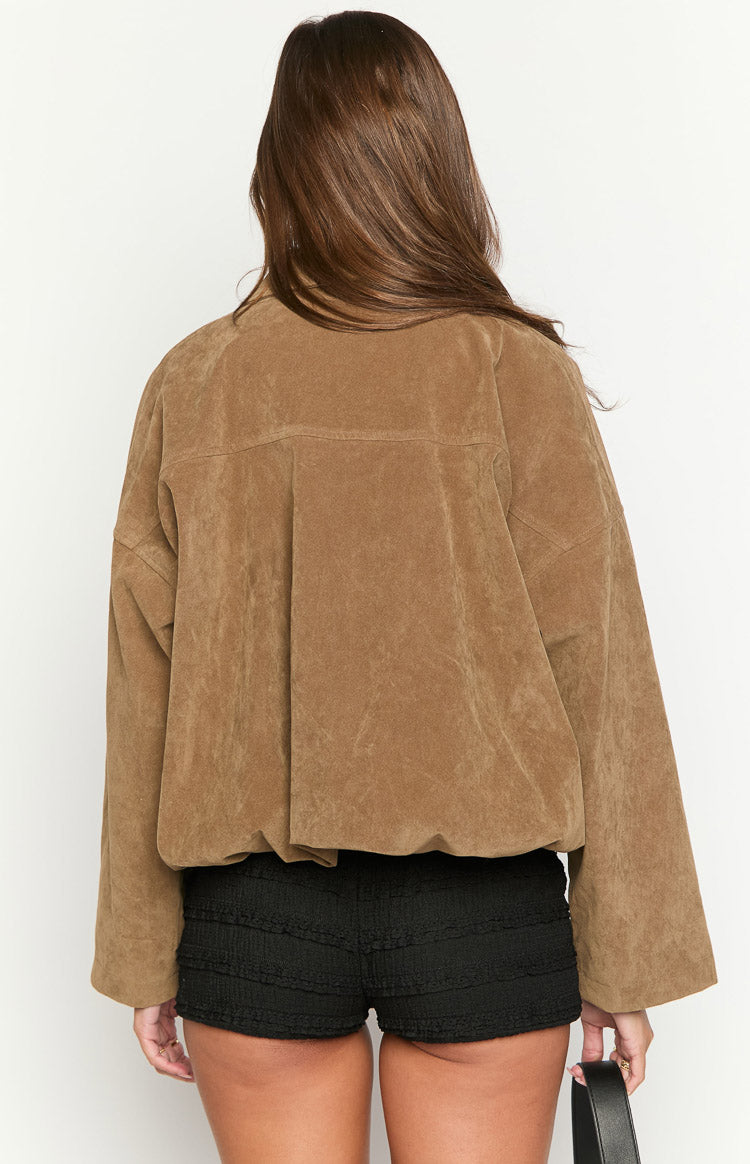 Rear view of a brown suedette bomber jacket with a bubble hem, wide sleeves, and back pleats