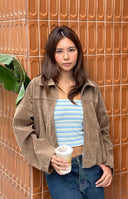 Beginning Boutique River Brown Suedette Bubble Hem Bomber Jacket brown suedette jacket with a collar, zip front, and bubble hem