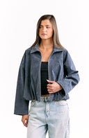 Model wears a steel grey suedette bomber jacket with a bubble hem for a cool street style look.