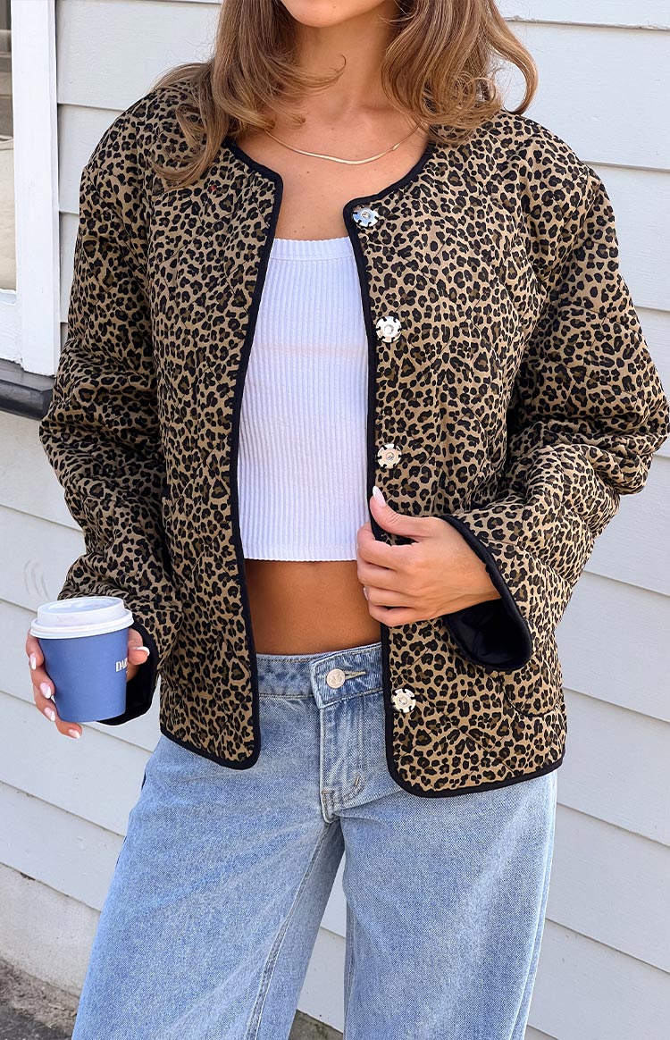Beginning Boutique Robbie Leopard Print Quilted Jacket tan and black leopard print quilted jacket with a collarless round neck black trim and silver snap buttons