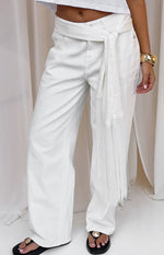 White satin fringe scarf belt tied around the waist with long tassels hanging down