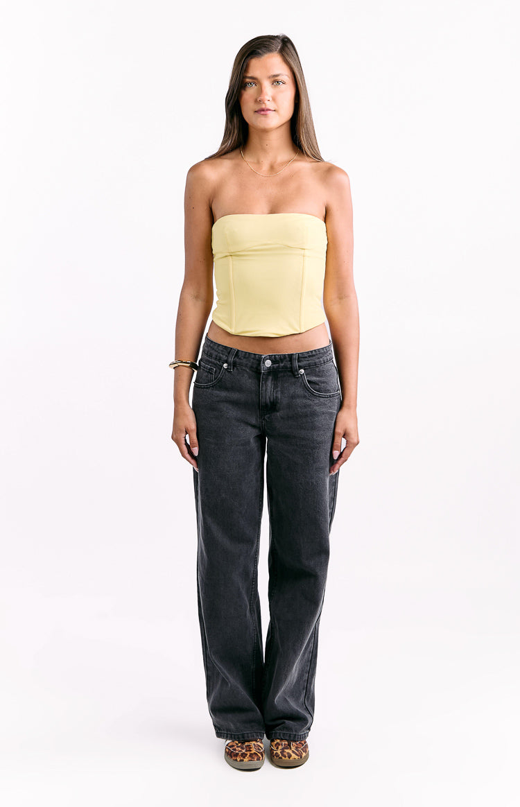 Front view of a yellow strapless corset top with visible boning details and a cropped hem