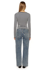 Rear view of the fitted navy and white striped long sleeve top with a subtle scoop back
