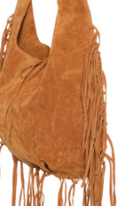 Close-up showing the tan suedette texture, long fringe detail on the side, and the top tie closure