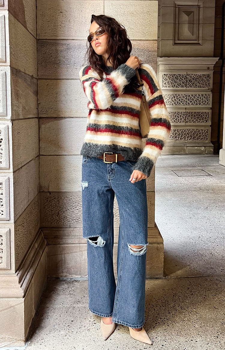 Beginning Boutique Roxie Mid Wash Ripped Jeans mid wash blue wide-leg jeans with ripped knees and a relaxed fit