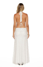Rear view of a white polka dot mesh top with halter neck tie and back tie closure