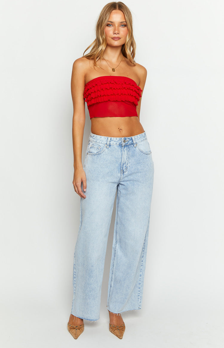 Front view of a red strapless tube top with multiple tiers of ruffles and a sheer cropped hem