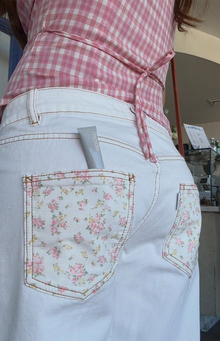 Rear view of the pink and white plaid top, showing the fitted silhouette and self-tie back