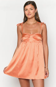 Orange satin mini dress with tied shoulder straps and a ruched sweetheart bust