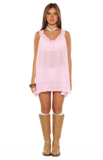 Pink sheer mini dress with frilled V-neckline, tie-front detail, and a relaxed fit with frilled hem
